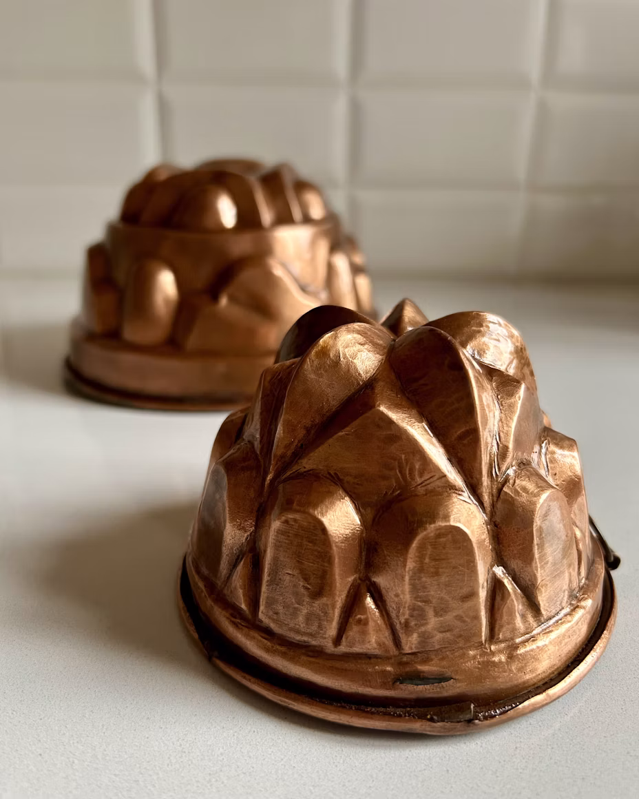 Two decorative antique copper ring-cake moulds