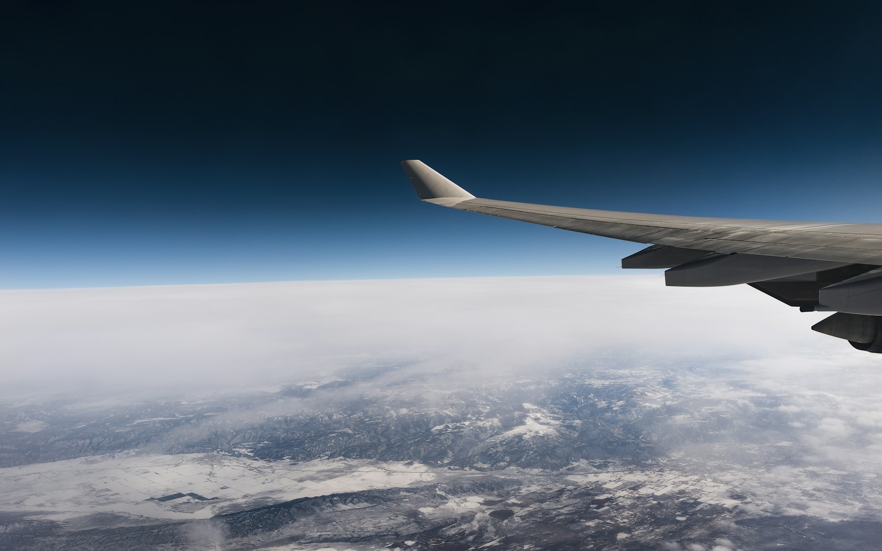 Aeroplane wing above the clouds