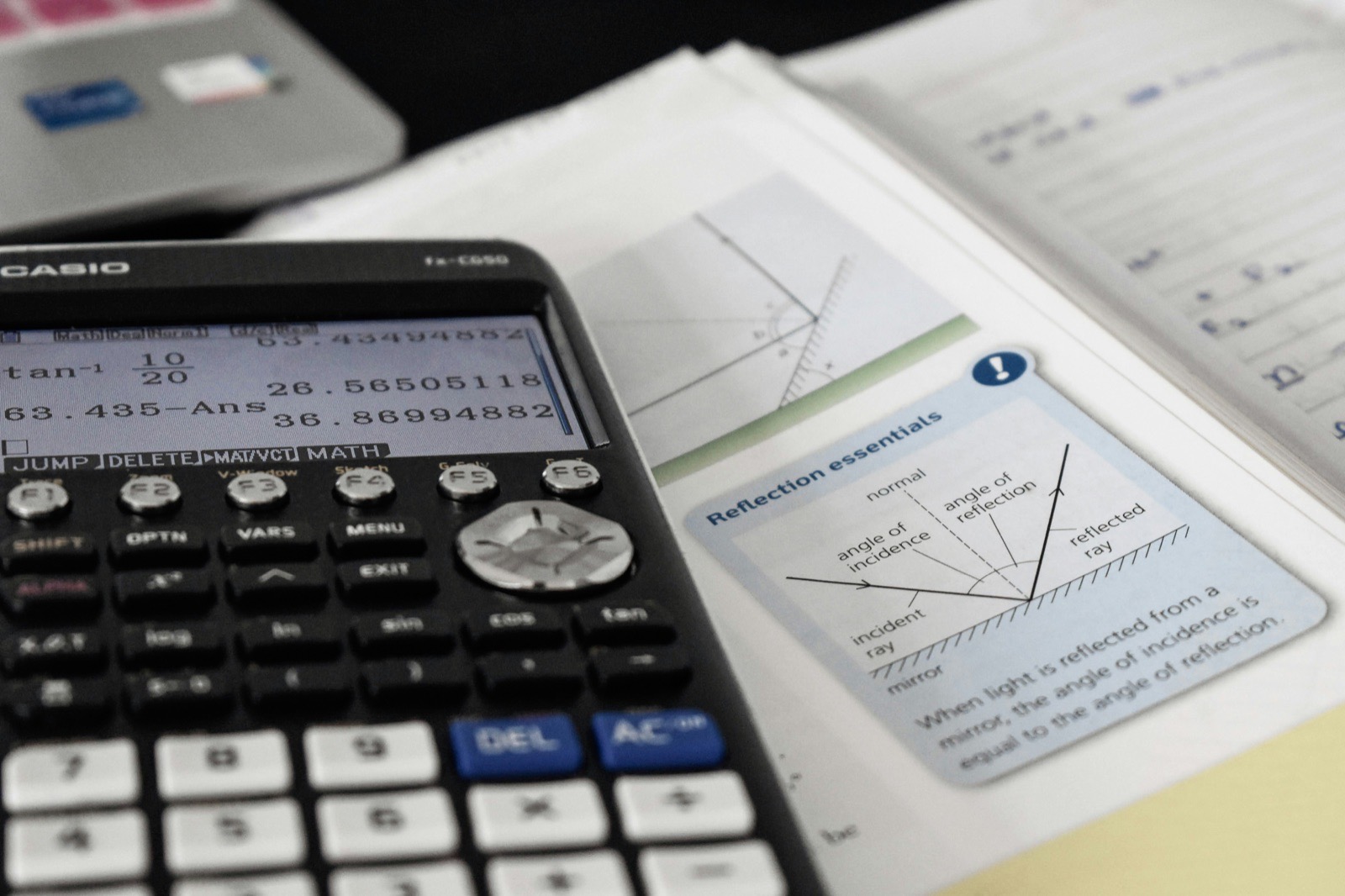 Calculator and open technical textbook.
