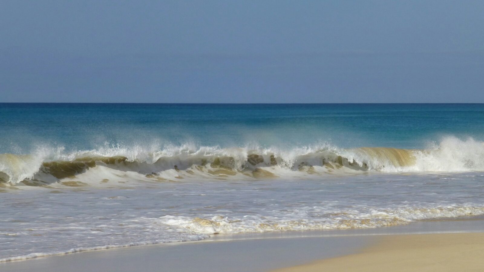 Quiet shoreline and Atlantic waves on Boa Vista, Cape Verde